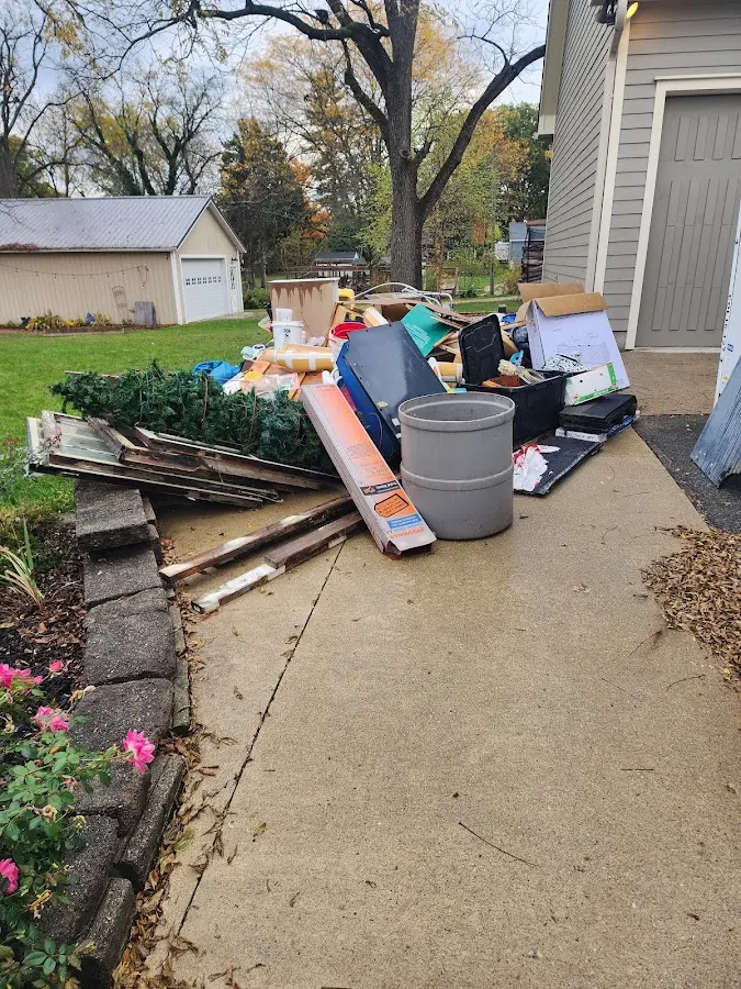 Dumpster being loaded with debris for 3 Yard Dumpster Rental in Pike Creek Valley